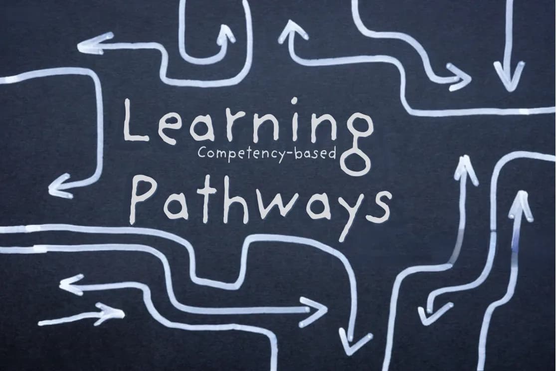 Chalk arrows around the words Learning Pathways on a blackboard