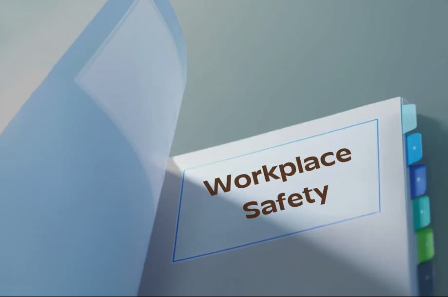 A policy binder with a tab headed Workplace Safety